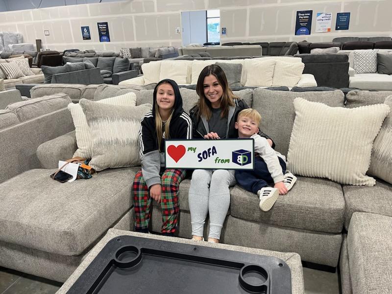 BoxDrop North Idaho customer Chelsea with her new Creswell sectional and ottoman