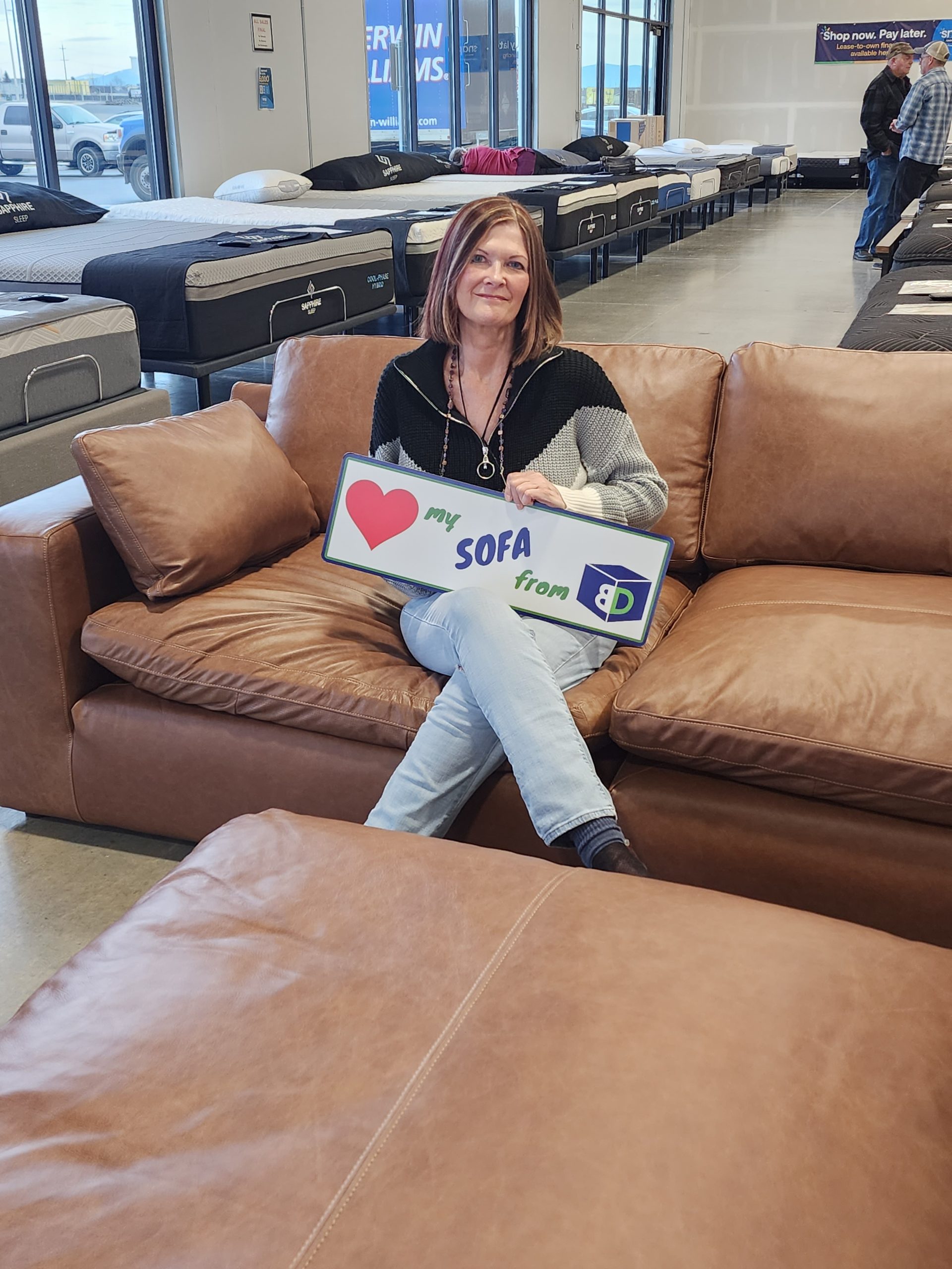BoxDrop North Idaho customer Rae Ann with her new Lexington Umber power recliner